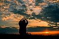 Give the gift on the Day of LoveRomantic girl walking in a field in sunset light. Winter, autumn life Royalty Free Stock Photo