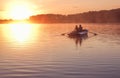 Romantic golden sunset river lake fog loving couple small rowing boat date beautiful Lovers ride during Happy woman man together r Royalty Free Stock Photo