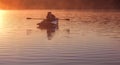 Romantic golden sunset river lake fog loving couple small rowing boat Romantic date beautiful Lovers ride boat during beautiful su Royalty Free Stock Photo