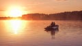 Romantic golden sunset river lake fog loving couple small rowing boat Romantic date beautiful Lovers ride boat during beautiful su Royalty Free Stock Photo