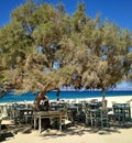 Romantic greek tavern on the Plaka beach. Naxos island, Greece. Royalty Free Stock Photo