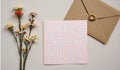 Romantic greeting card with floral decor and envelope on beige background Royalty Free Stock Photo