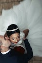 Romantic groom kissing brunette bride on the neck, shot from above closeup