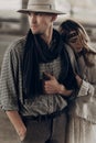 Romantic gypsy woman in stylish boho clothes and white dress hug Royalty Free Stock Photo