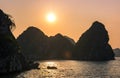 Romantic Halong bay sunset over limestone rocks, Vietnam Royalty Free Stock Photo