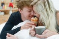 Romantic happy couple having breakfast in bed Royalty Free Stock Photo