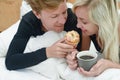 Romantic happy couple having breakfast in bed Royalty Free Stock Photo