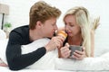 Romantic happy couple having breakfast in bed Royalty Free Stock Photo