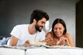 Romantic happy couple in love having breakfast in bed Royalty Free Stock Photo