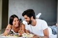 Romantic happy couple in love having breakfast in bed Royalty Free Stock Photo