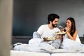 Romantic happy couple having breakfast in bed Royalty Free Stock Photo