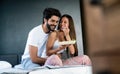 Romantic happy couple having breakfast in bed Royalty Free Stock Photo