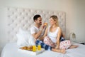 Romantic happy couple having breakfast in bed Royalty Free Stock Photo