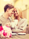 Romantic happy couple kissing in the cafe Royalty Free Stock Photo