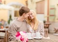 Romantic happy couple kissing in the cafe Royalty Free Stock Photo