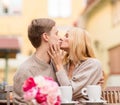 Romantic happy couple kissing in the cafe Royalty Free Stock Photo