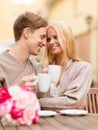 Romantic happy couple kissing in the cafe Royalty Free Stock Photo