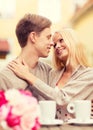 Romantic happy couple kissing in the cafe Royalty Free Stock Photo