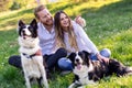 Romantic happy couple in love enjoying their time with pets in nature Royalty Free Stock Photo