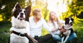 Romantic happy couple in love enjoying their time with pets in nature Royalty Free Stock Photo