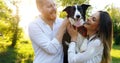 Romantic happy couple in love enjoying their time with pets in nature Royalty Free Stock Photo