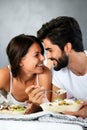 Romantic happy couple in love having breakfast in bed Royalty Free Stock Photo