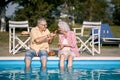 Romantic elderly couple  enjoy on summer holiday near swimming pool and  eating watermelon Royalty Free Stock Photo