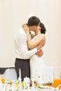 Romantic happy handsome groom kissing beautiful white dress bride at wedding reception Royalty Free Stock Photo