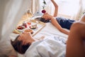 Romantic lesbian in bed with rose..Gay Couple in bed Royalty Free Stock Photo