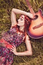 Romantic hippy girl travelling with her guitar. Summer Royalty Free Stock Photo