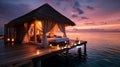 Romantic Hotels and Resorts on Maldives straw cabin evening blurred light blue sea water