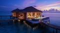 Romantic Hotels and Resorts on Maldives straw cabin evening blurred light blue sea water