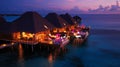 Romantic Hotels and Resorts on Maldives straw cabin evening blurred light blue sea water