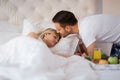 Romantic husband waking wife with breakfast Royalty Free Stock Photo