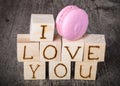 Romantic inscription of letters on light wooden cubes on a old g Royalty Free Stock Photo