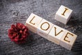 Romantic inscription of letters on light wooden cubes on a old g Royalty Free Stock Photo