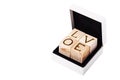 Romantic inscription of letters on light wooden cubes in white b Royalty Free Stock Photo