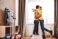 Romantic jorney. Couple kissing in rental appartment while traveling