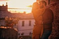 Romantic kiss at beautiful sunset.Young couple in love