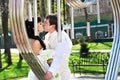 Romantic kiss bride and groom about art ironwork Royalty Free Stock Photo