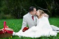 Romantic kiss bride and groom on wedding picnic Royalty Free Stock Photo