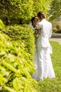 Romantic kiss bride and groom on wedding walk Royalty Free Stock Photo