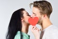 Romantic kiss concept. Couple in love kissing and hide lips behind heart card. Celebrate valentines day. Sensual kiss of Royalty Free Stock Photo