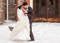 Romantic kiss happy bride and groom on winter wedding day Royalty Free Stock Photo