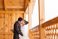 Romantic kiss happy bride and groom on winter wedding day Royalty Free Stock Photo