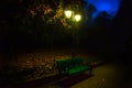 Romantic landscape in the evening in the park in late autumn with a lantern