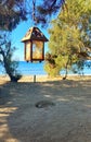 Romantic lantern on a sandy beach in Vasilikos, Greece Royalty Free Stock Photo