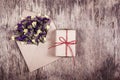 Romantic letter with flowers. Envelope with flowers and a gift.