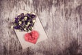 Romantic letter. Wild flowers and a paper heart. Heart of origami. Royalty Free Stock Photo