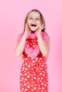 Romantic love concept Sweetheart child with long hair smiling in red dress. Royalty Free Stock Photo